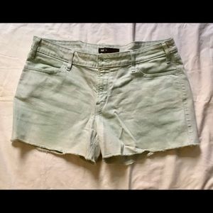 Pale teal Levi’s denim cutoffs 14